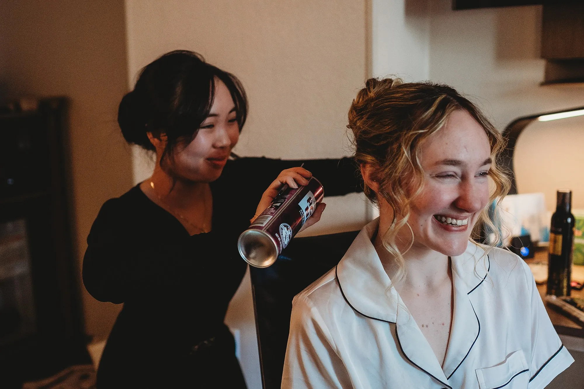 Elizabeth setting a bride's hair before the ceremony